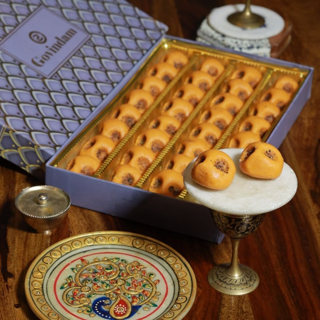 Close-up of Rajasthani peda texture showing fine grains and a rustic, crumbly surface