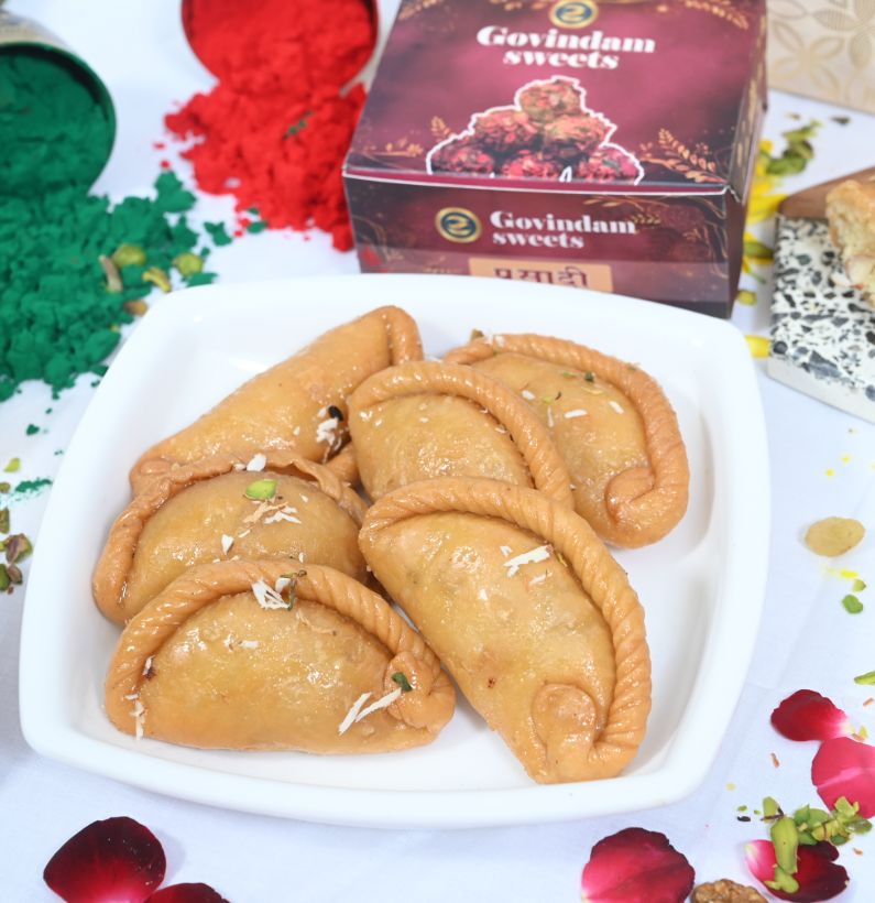Gujiya sweets neatly arranged in a designer festive gift box