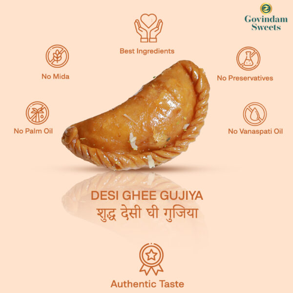 Gujiyas served on brass plate with Holi color powders and marigold flowers